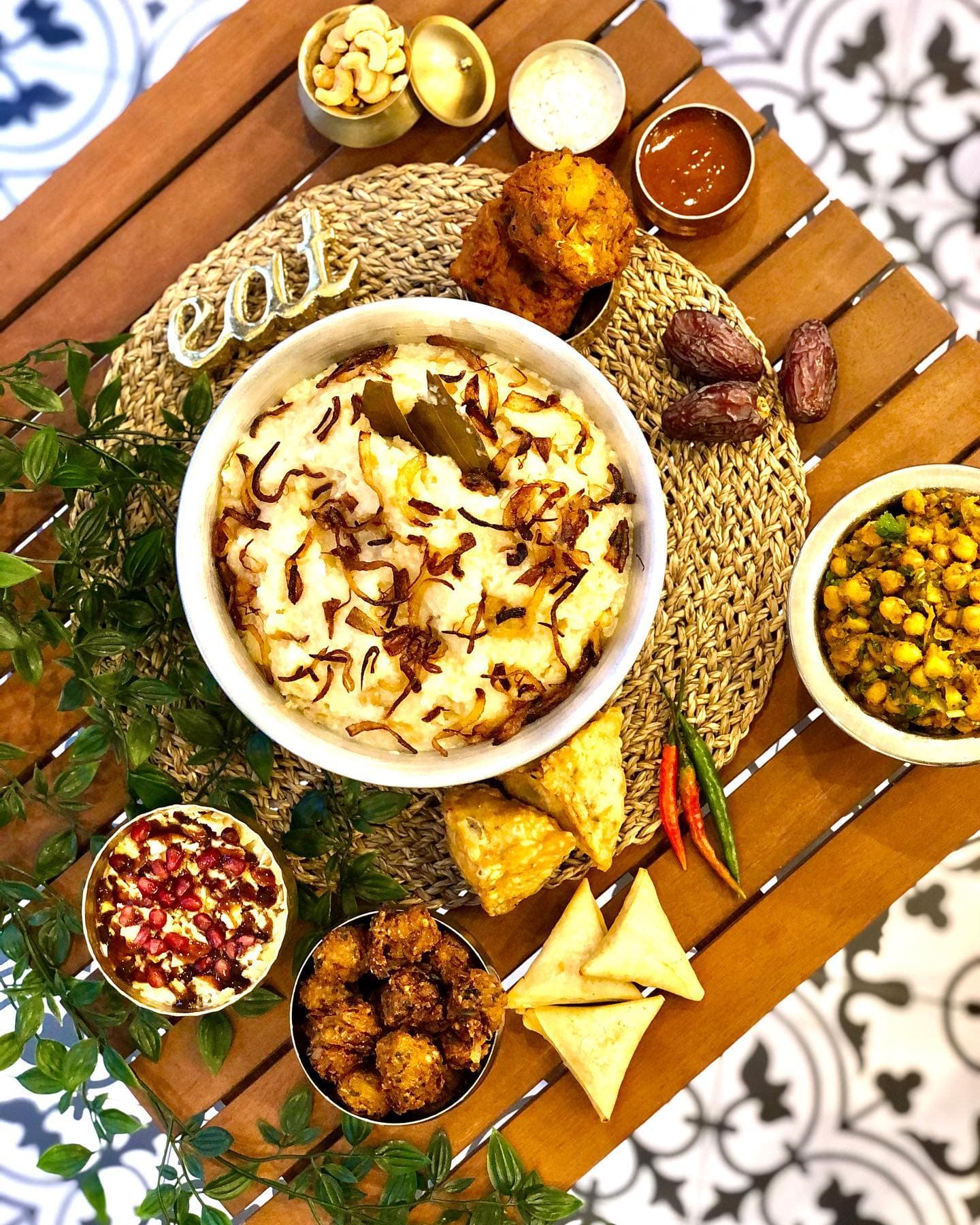 A Dawat table spread — plates passed around